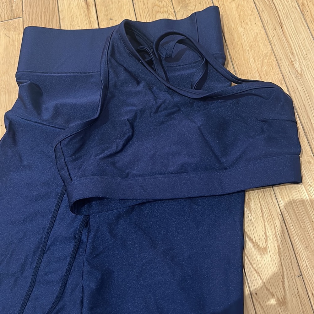 All access navy blue high waisted biker short set with one shoulder sports bra